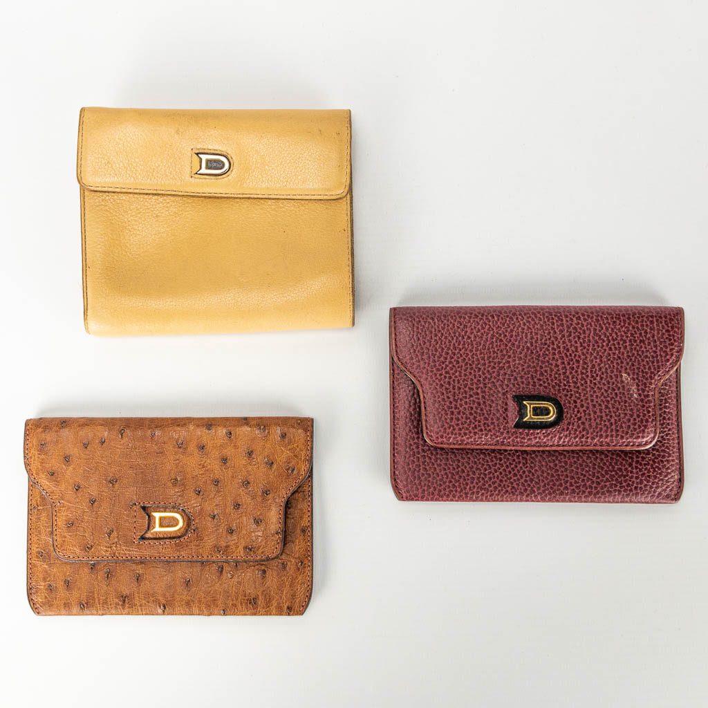 A collection of 3 ladies wallets made of leather and marked Delvaux