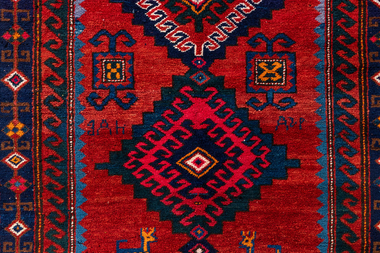 An Oriental hand-made carpet, Kazak. (D:230 x W:150 cm)