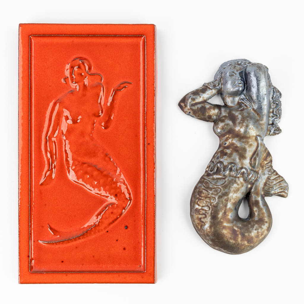 A collection of 2 ceramic mermaids, of which one is marked Perignem. (15 x 28,5cm)