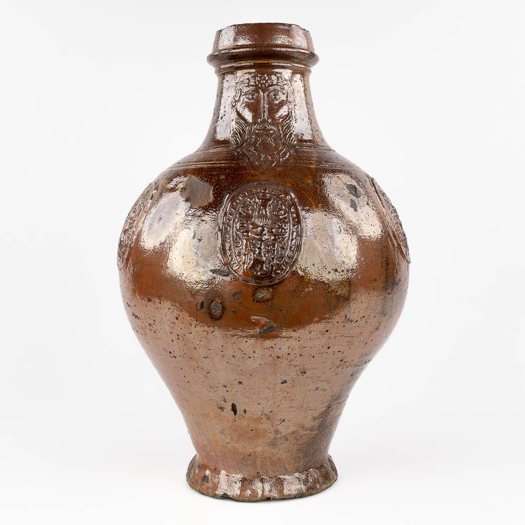  An antique Bartmann Jug, grès stoneware, decorated with 3 cartouches. 17th C. 
