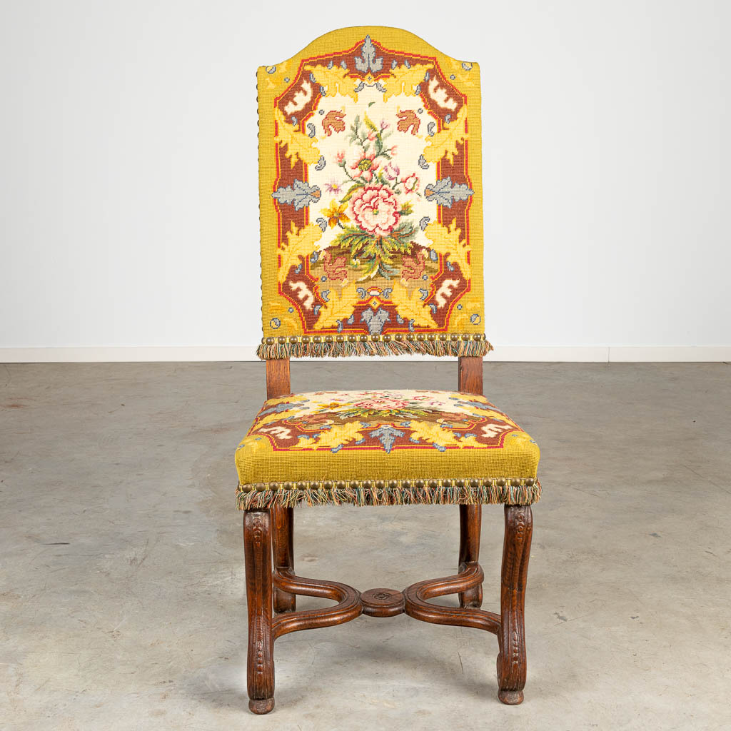 A set of 8 Os De Mouton chairs with embroidered fabric. 