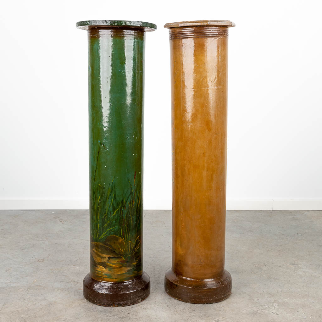 A set of 2 pedestals made of grès with hand-painted flower decor. (H:105cm)
