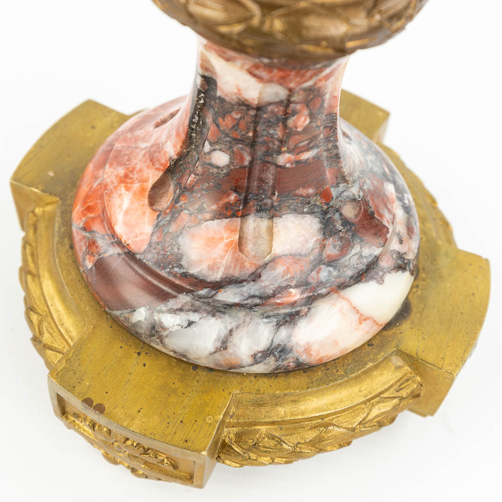 A pair of cassolettes made of red marble mounted with gilt bronze in Louis XVI style. (H:51cm)