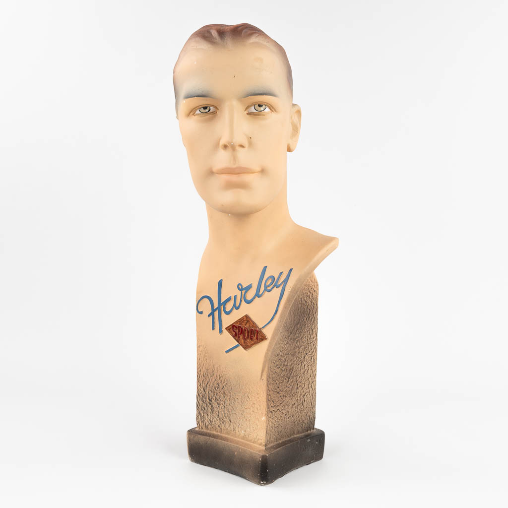 Novita, a men's bust 'Harley Sport', moulded and polychrome plaster.  (L:18,5 x W:20 x H:58 cm)