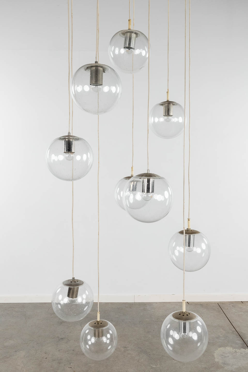 Raak, Amsterdam, a large ceiling lamp with 10 glass balls. 20th C. (D:70 cm)