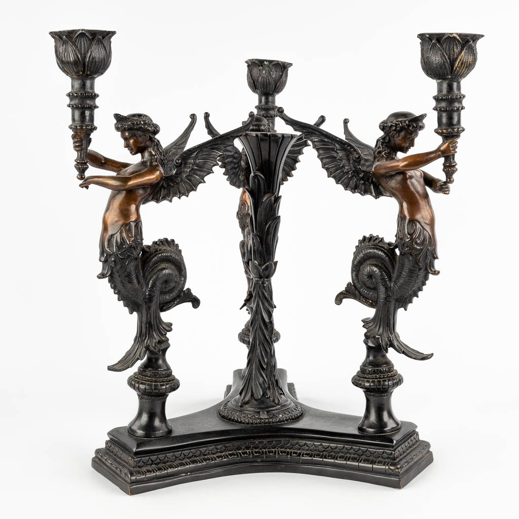 A large table candelabra decorated with three 
