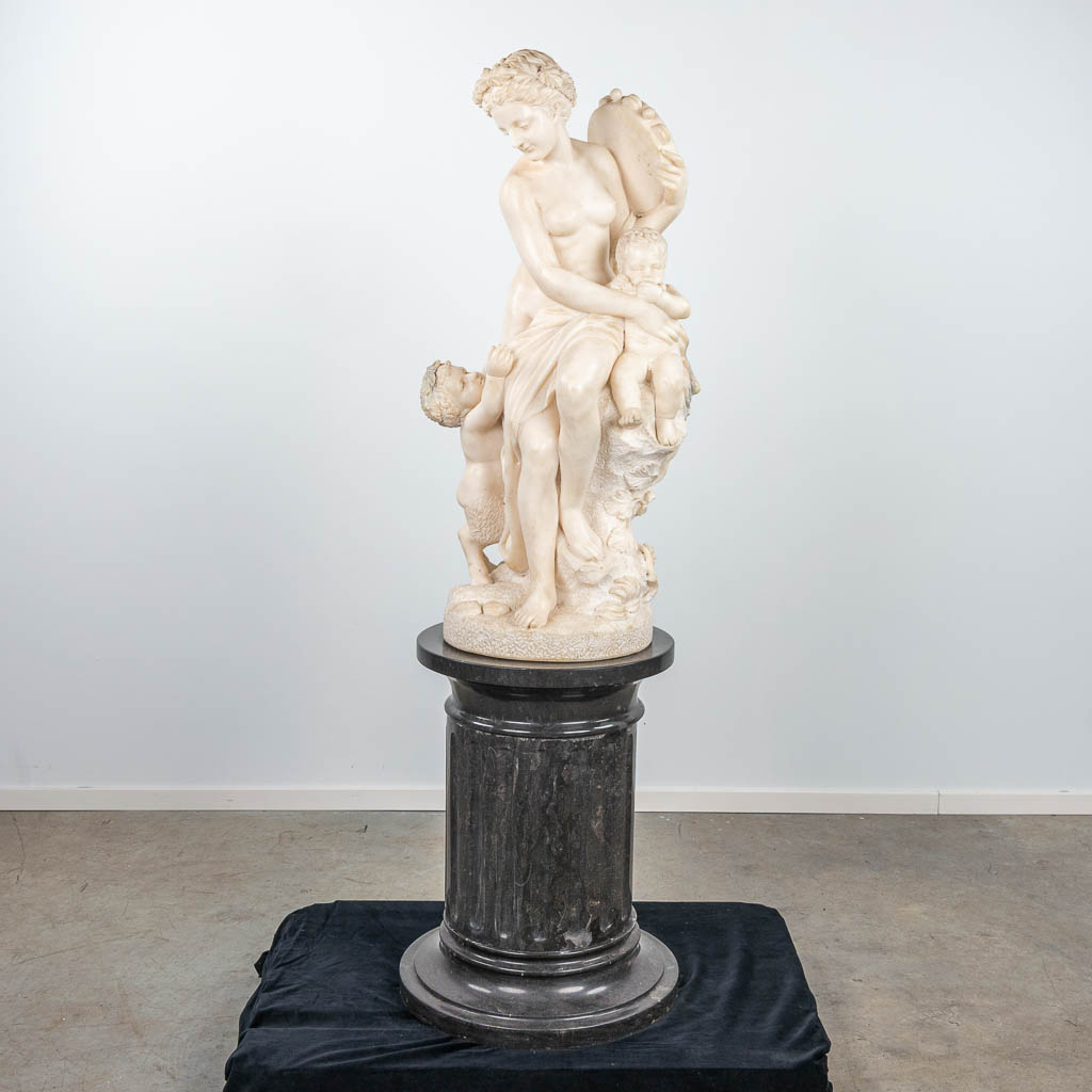 An exceptional statue made of white Carrara marble 'Lady with a Satyr'. (H:120cm)