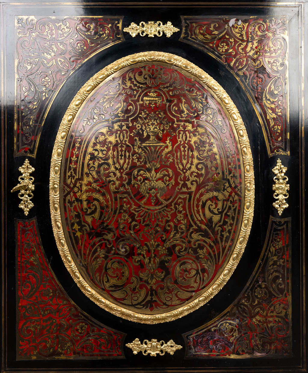 A single door cabinet finished with boulle tortoise shell inlay and mounted with gilt bronze. Napoleon 3. 