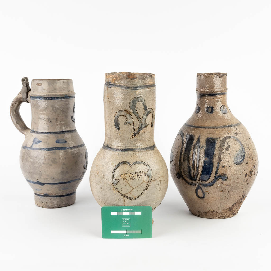 Three antique pitchers, grès, probably Germany, 18th C. (H:28 x D:14 cm)