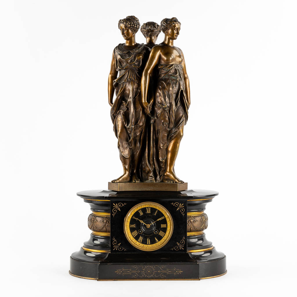 Lot 034 A mantle clock with patinated bronze figurines of 