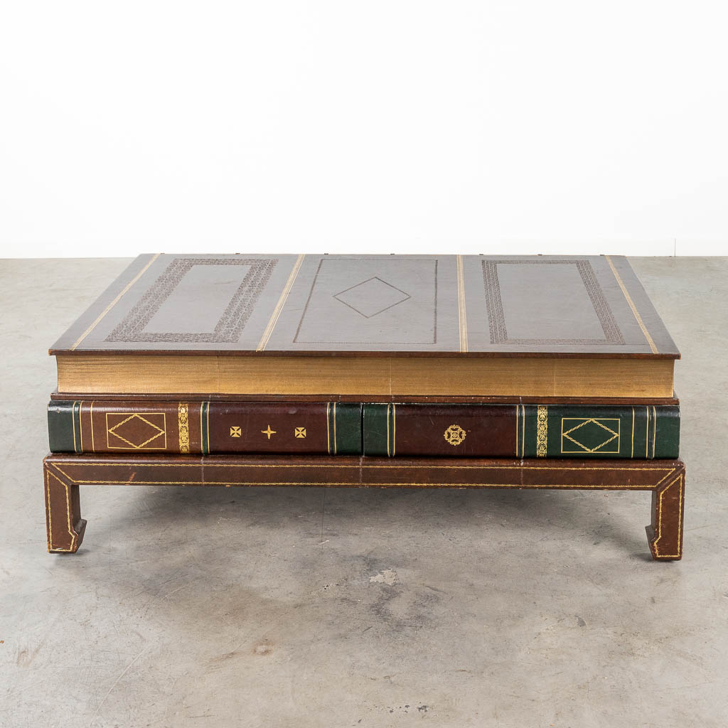 A coffee table in the shape of a large book, circa 1980. (D:79 x W:122 x H:42 cm)