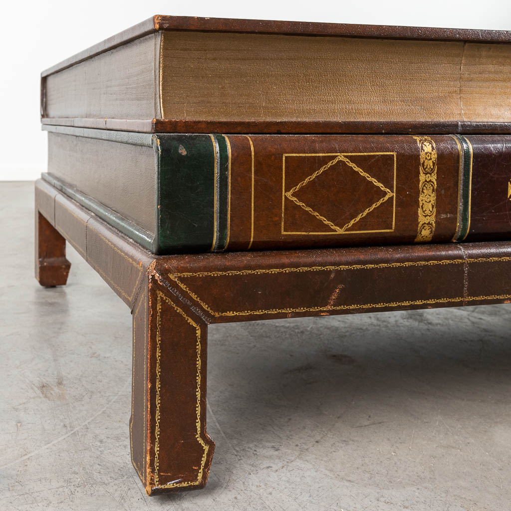 A coffee table in the shape of a large book, circa 1980. (D:79 x W:122 x H:42 cm)