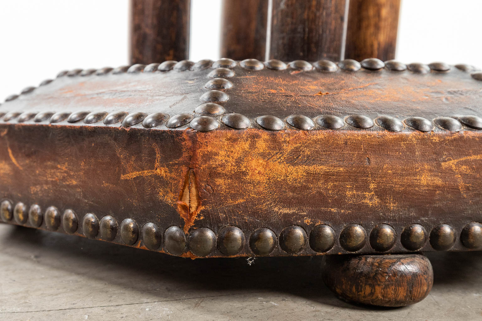 A coffee table made of leather and finished with nails in art deco style. (H:58cm)