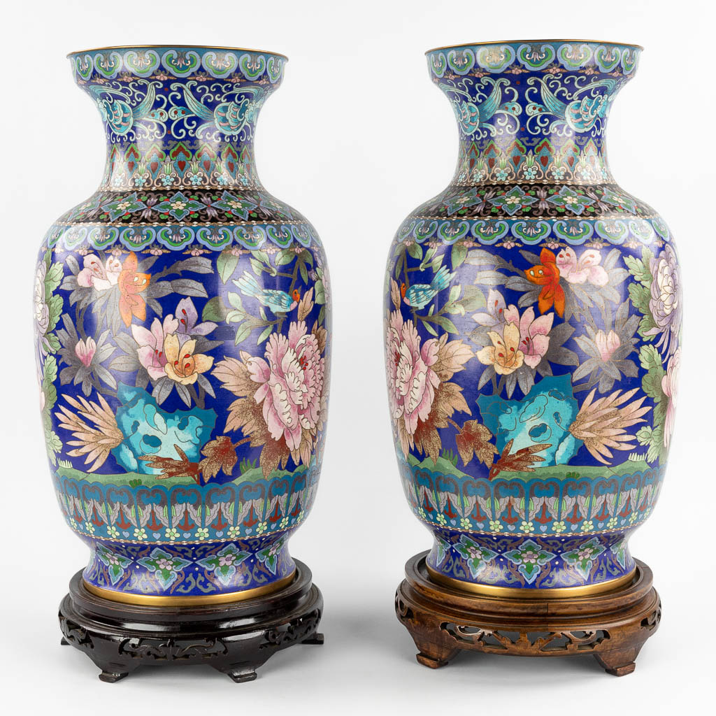 A pair of large cloisonné vases decorated with fauna and flora. 20th C. (H:51 x D:28 cm)