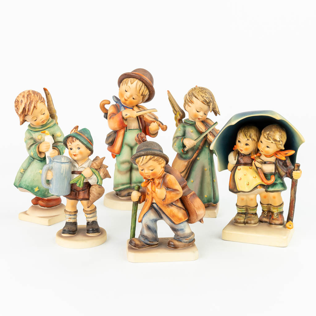 A collection of 6 Hummel statues: : 21/I, 188-1948, 71, 89/I, 2/I, made by Goebel in Germany. (H:21cm)