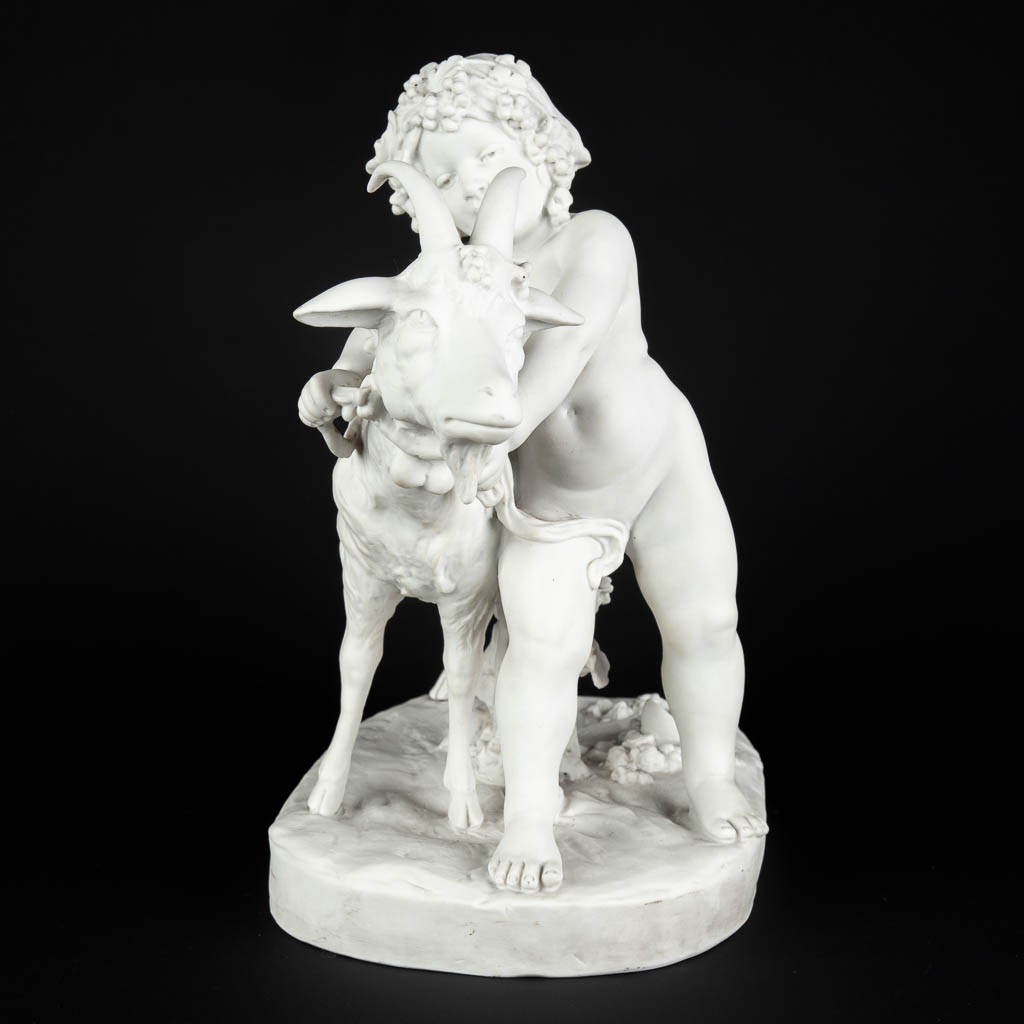 FAGOTTO (XIX-XX) 'Child with a ram' Bisque porcelain, marked Sèvres, Paris. (D:19 x W:33 x H:32 cm)