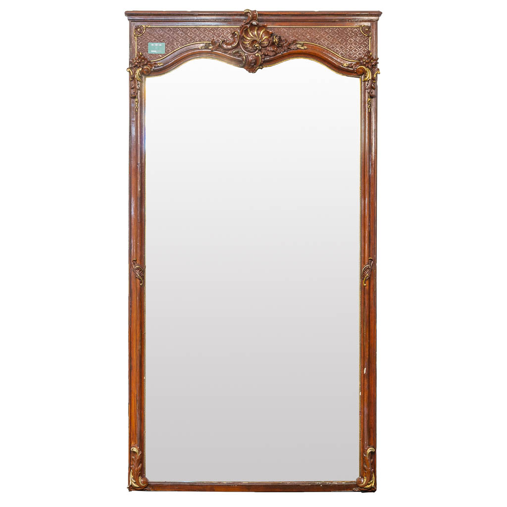 A large mirror made of sculptured wood and stucco in Louis XV style. (H:243cm)