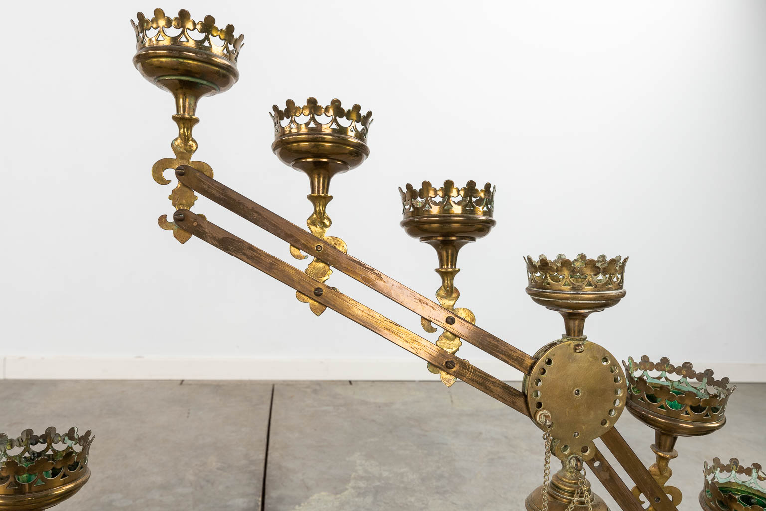 A pair of bronze candelabra with adjustable arms, and 7 candle holders. Decor of Fleur De Lis. (W:76 x H:52 cm)