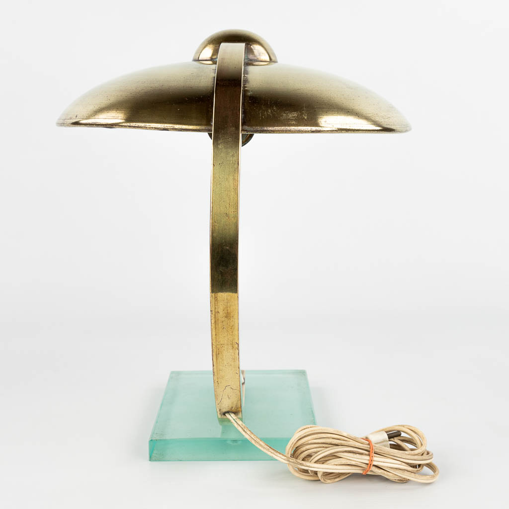 A table lamp made of metal and mounted on a glass base, in the style of Egon Hillebrand. The 1950s. (H:33cm)