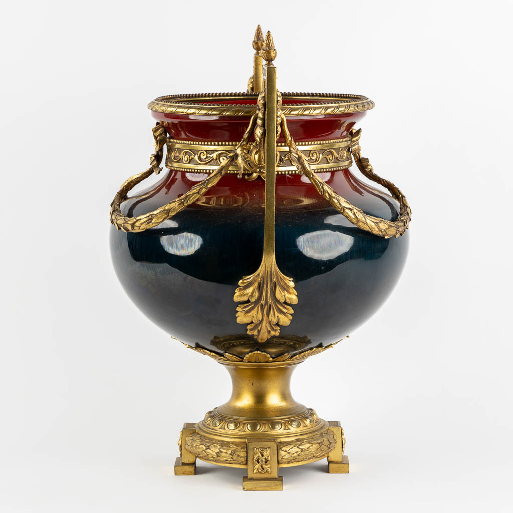 A large faience vase mounted with gilt bronze in Louis XV style. Circa 1900. (L:34 x W:40 x H:50 cm)