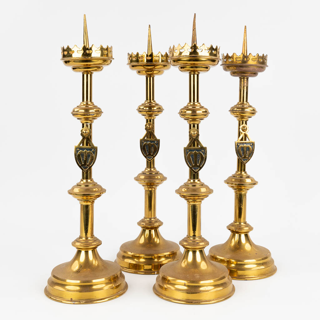 A set of 4 Church candlesticks made of bronze in gothic revival style. (H: 50 cm)