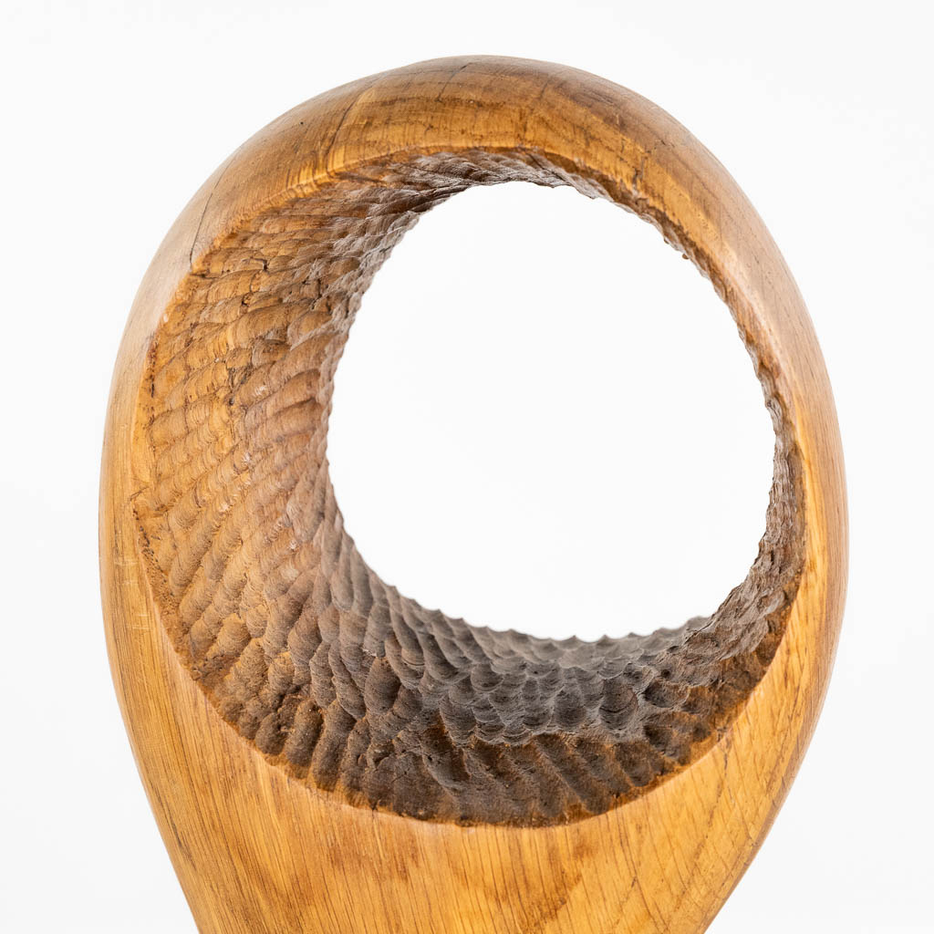 An abstract wood sculpture, marked J.D. 1972. (L:15 x W:22 x H:99 cm)