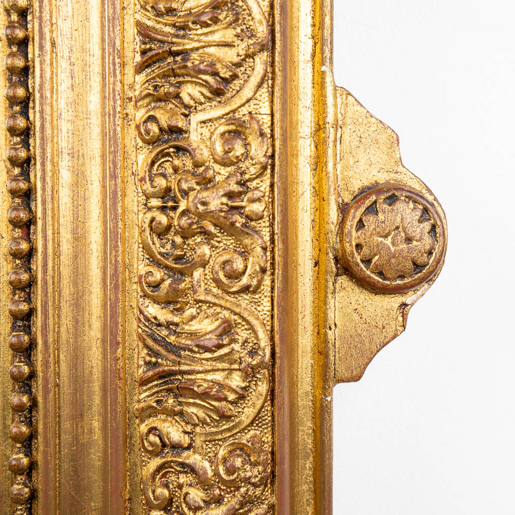 An antique mirror, gilt stucco. Circa 1900. (W:61 x H:114 cm)