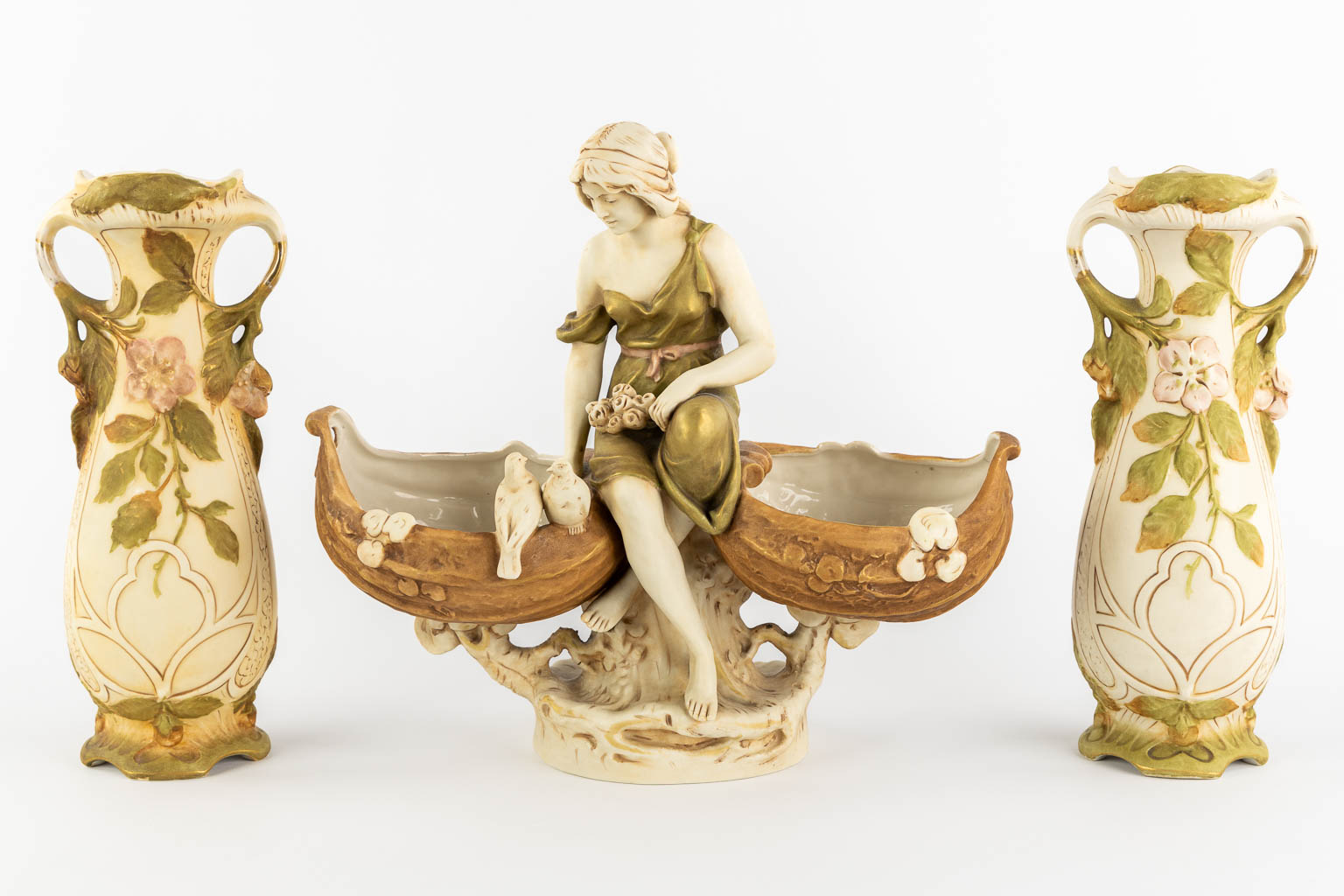 Royal Dux, a pair of vases and a lady with two baskets. Polychrome porcelain. (L:17 x W:36 x H:32 cm)