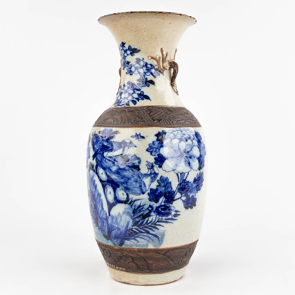 A Chinese vase, Nanking stoneware with blue-white decor. 20th century. (H: 45 x D: 21 cm)