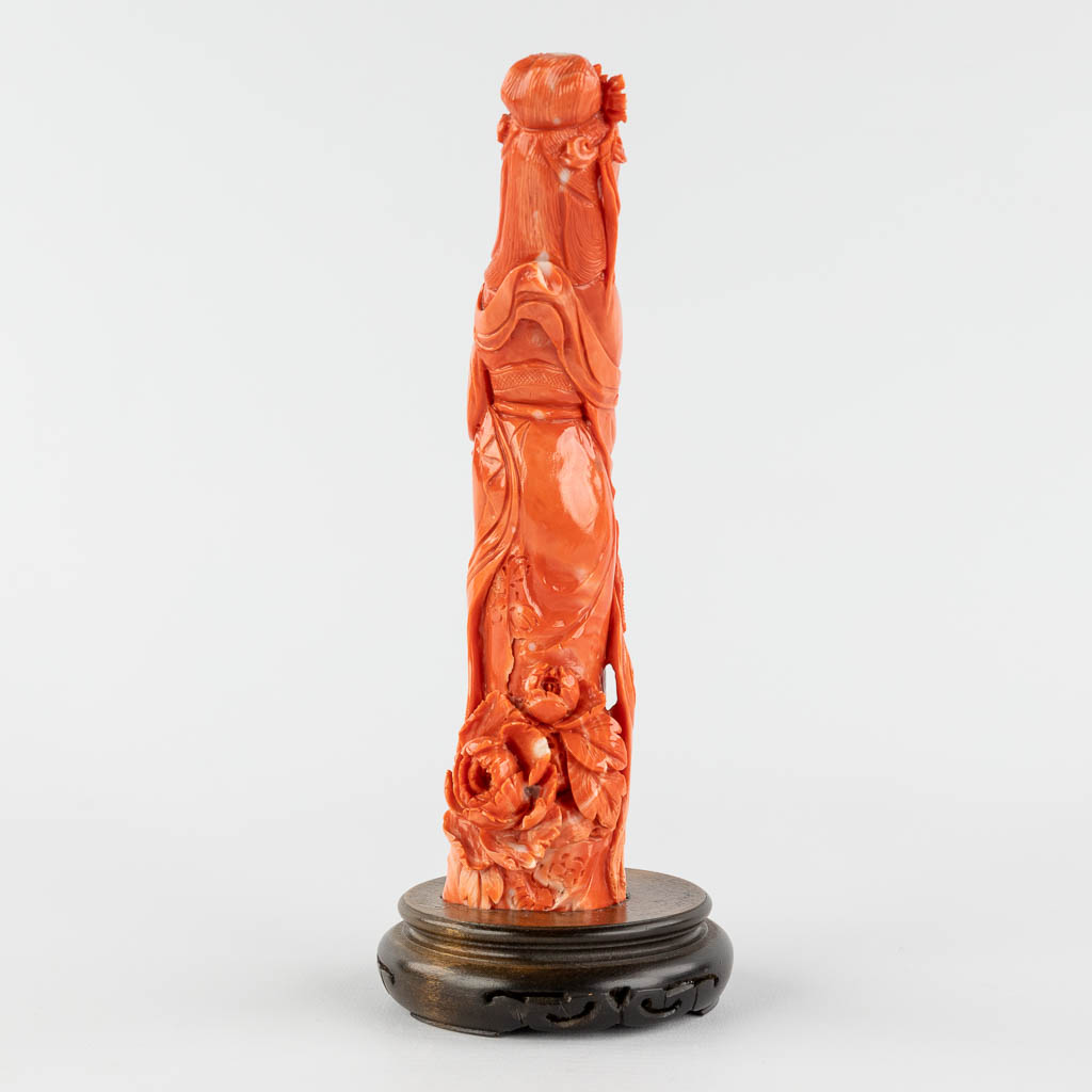 A finely sculptured red coral, image of an elegant lady. 19th C. 395g. (H:19,5 cm)