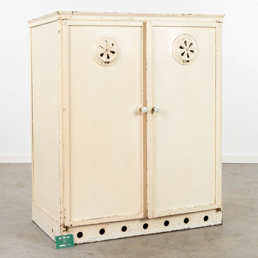 An antique plate warming cabinet made of metal. (H:105cm)