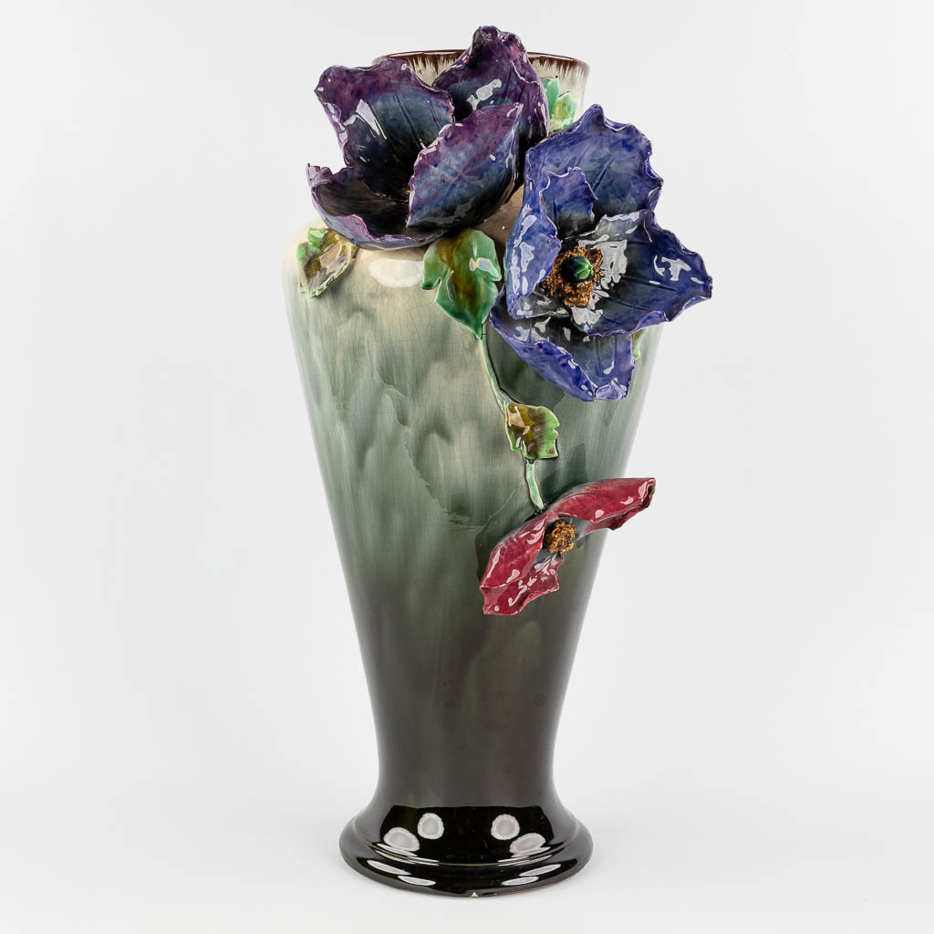  A large vase made of Hasselt Earthenware, decorated with Flowers. Made in Hasselt, Belgium. Circa 1900. 