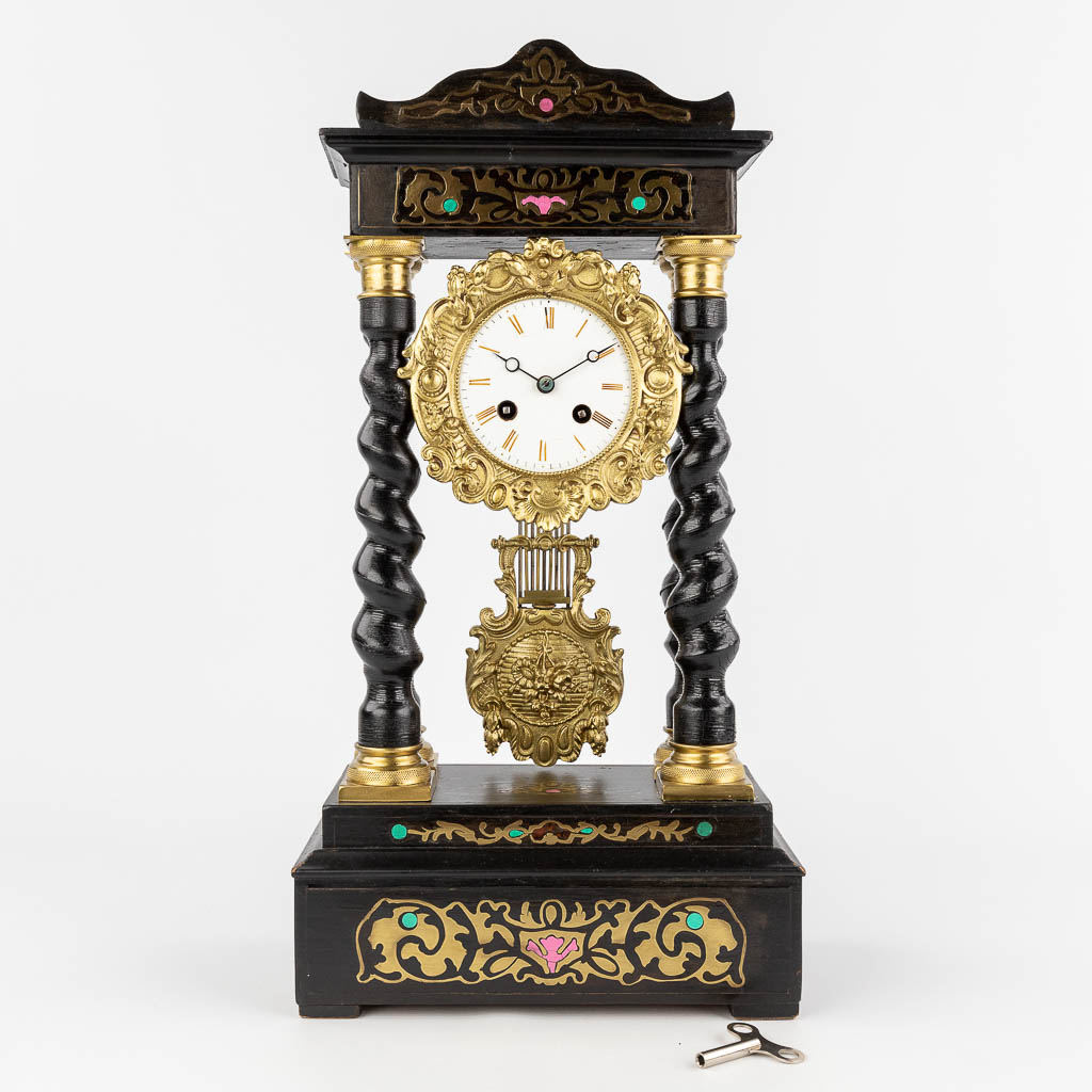  A column clock finished with copper inlay in Napoleon 3 style. 19th C. 