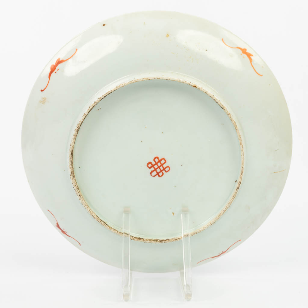 A collection of 7 Chinese Famille Rose plates with hand-painted flower decors. 