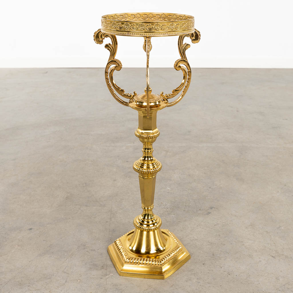 Twelve Church candlesticks. Gold-plated brass, 20th C. (H:53 x D:23 cm)