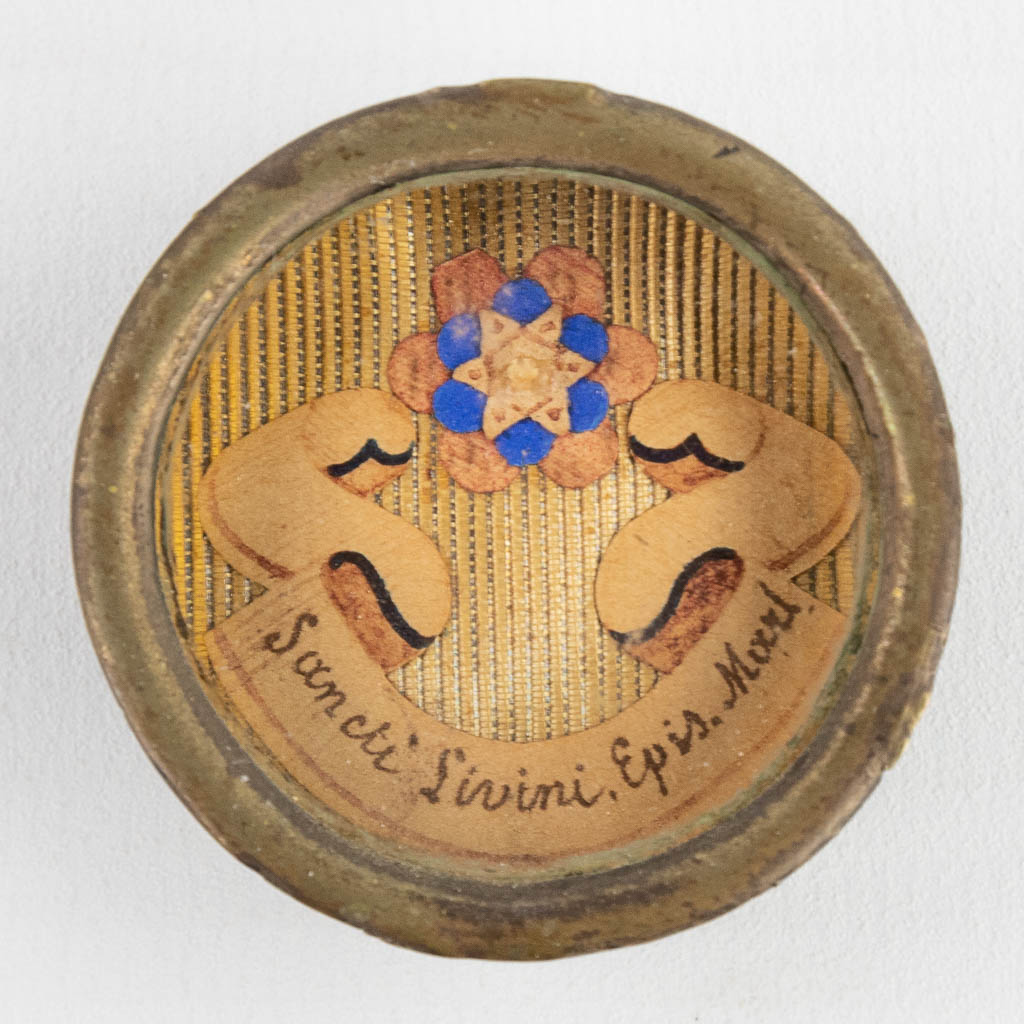 A theca with a relic: Ex Ossibus Sancti Livini, Episc. Marti.