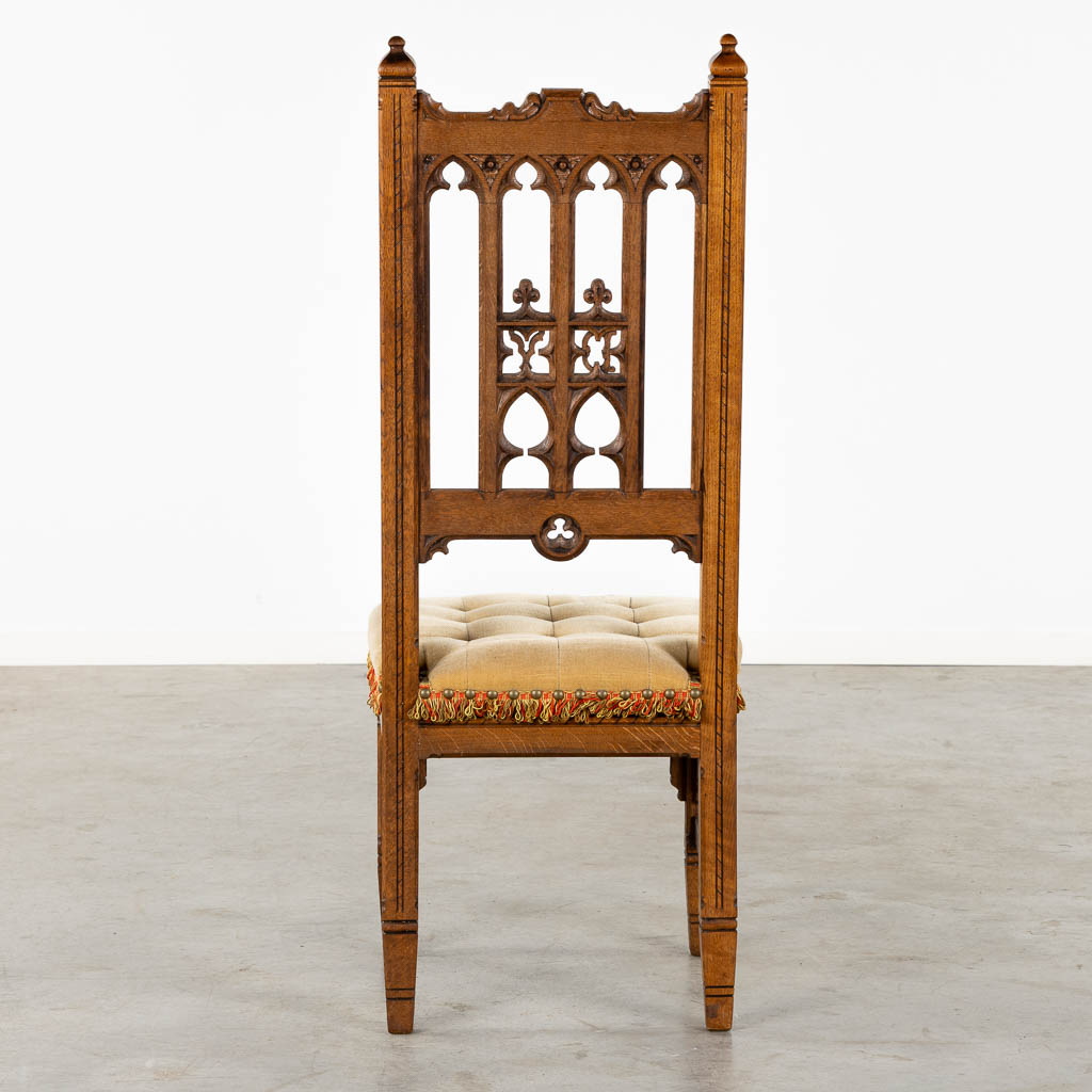 8 Gothic Revival style chairs, sculptured wood. Circa 1900. (L:54 x W:48 x H:123 cm)
