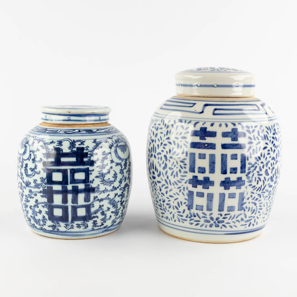 Two Chinese ginger jars with a blue-white decor of Happiness, Double Xi sign. 19th/20th C. (H:27 x D:20 cm)