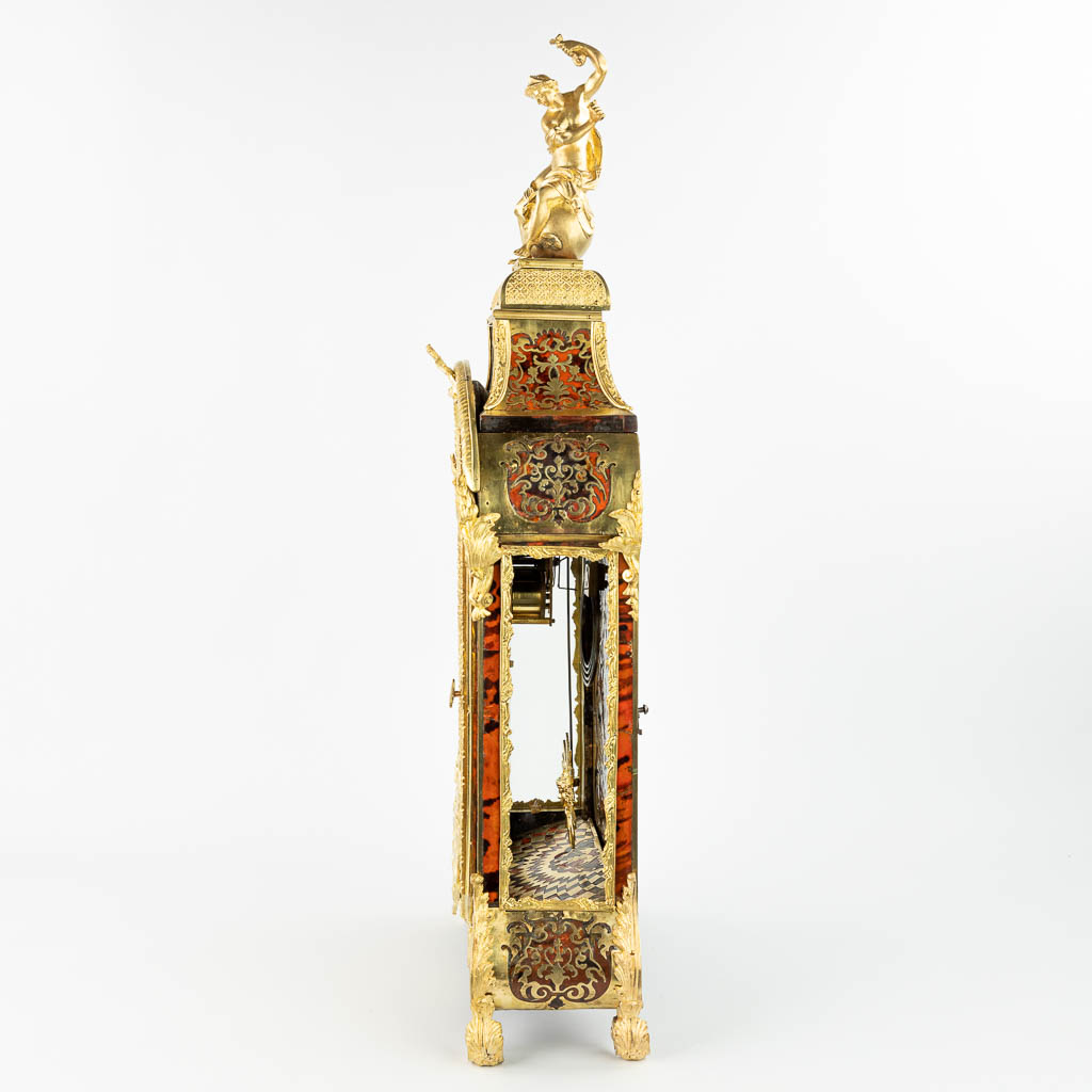 A Kartell clock finished with boulle inlay and mounted with bronze. Signed Martenot à Paris. (H:85cm)