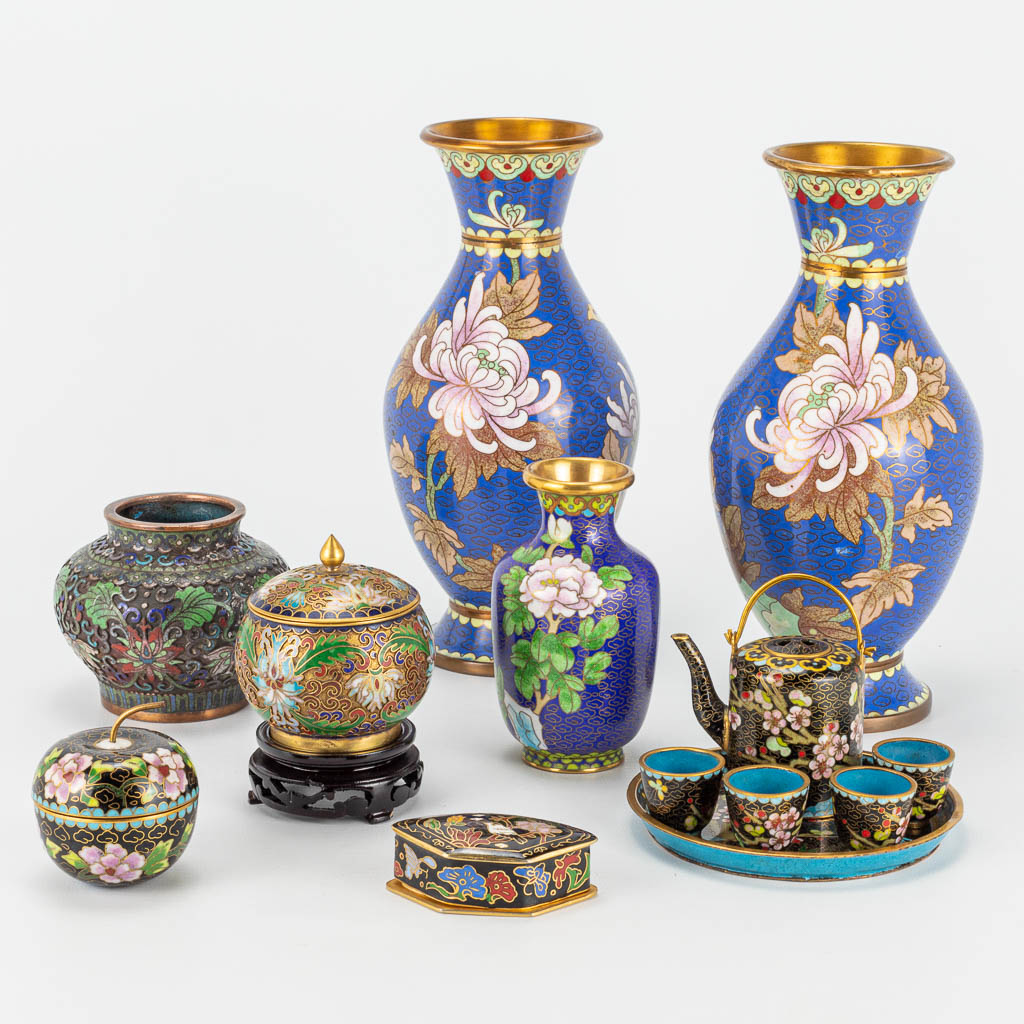 A collection of bronze items with a cloisonné decor.