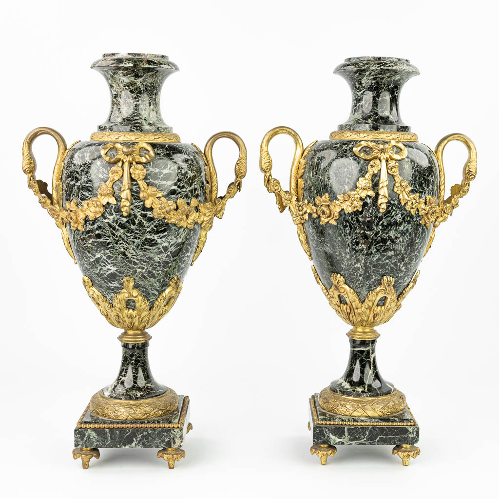 A pair of cassolettes made of green marble and mounted with gilt bronze. (H:51cm)