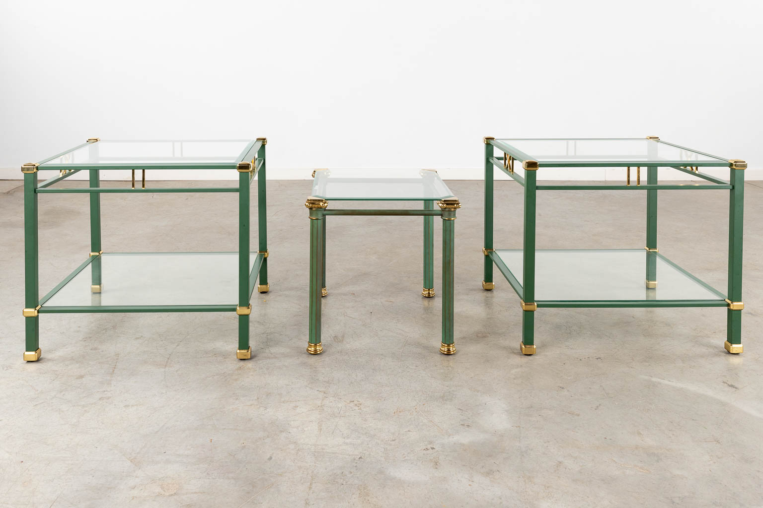 4 matching coffee and side tables, lacquered metal and glass, circa 1980. (D:58 x W:118 x H:46 cm)