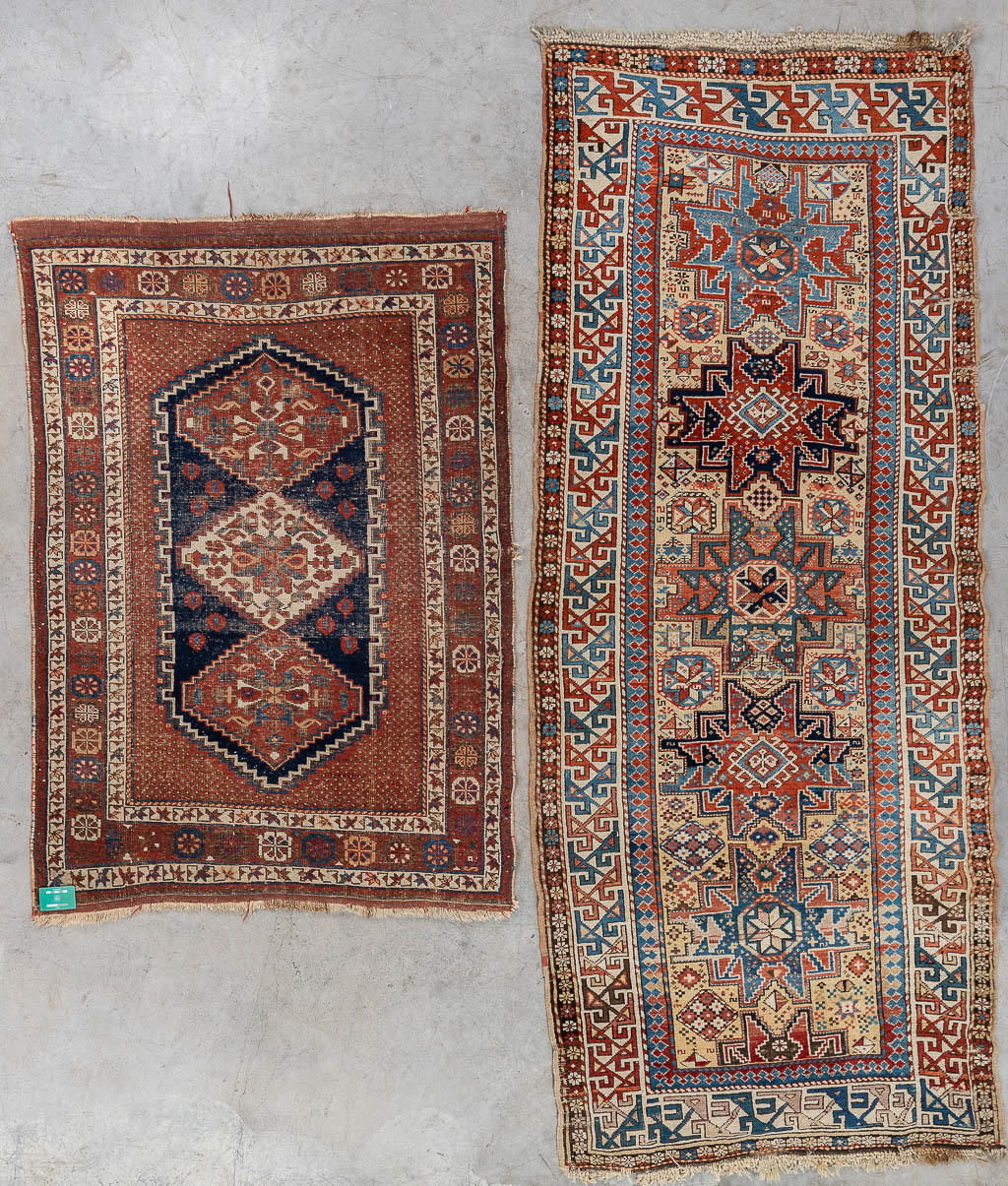 A collection of 2 Oriental hand-made carpets. Probably Caucasian. (L: 277 x W: 115 cm)