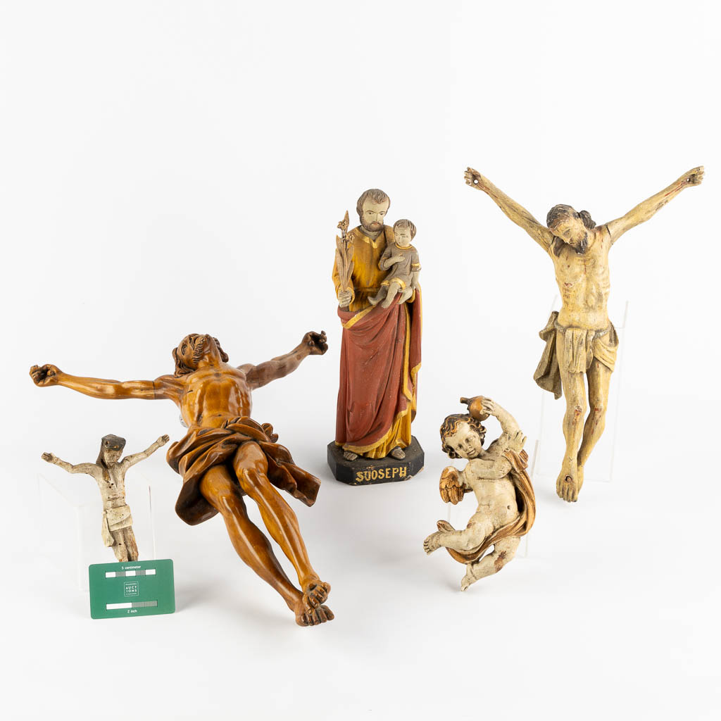 A collection of wood sculptured Corpus Christi and Saints. 19th and 20th C. (W:38 x H:53 cm)