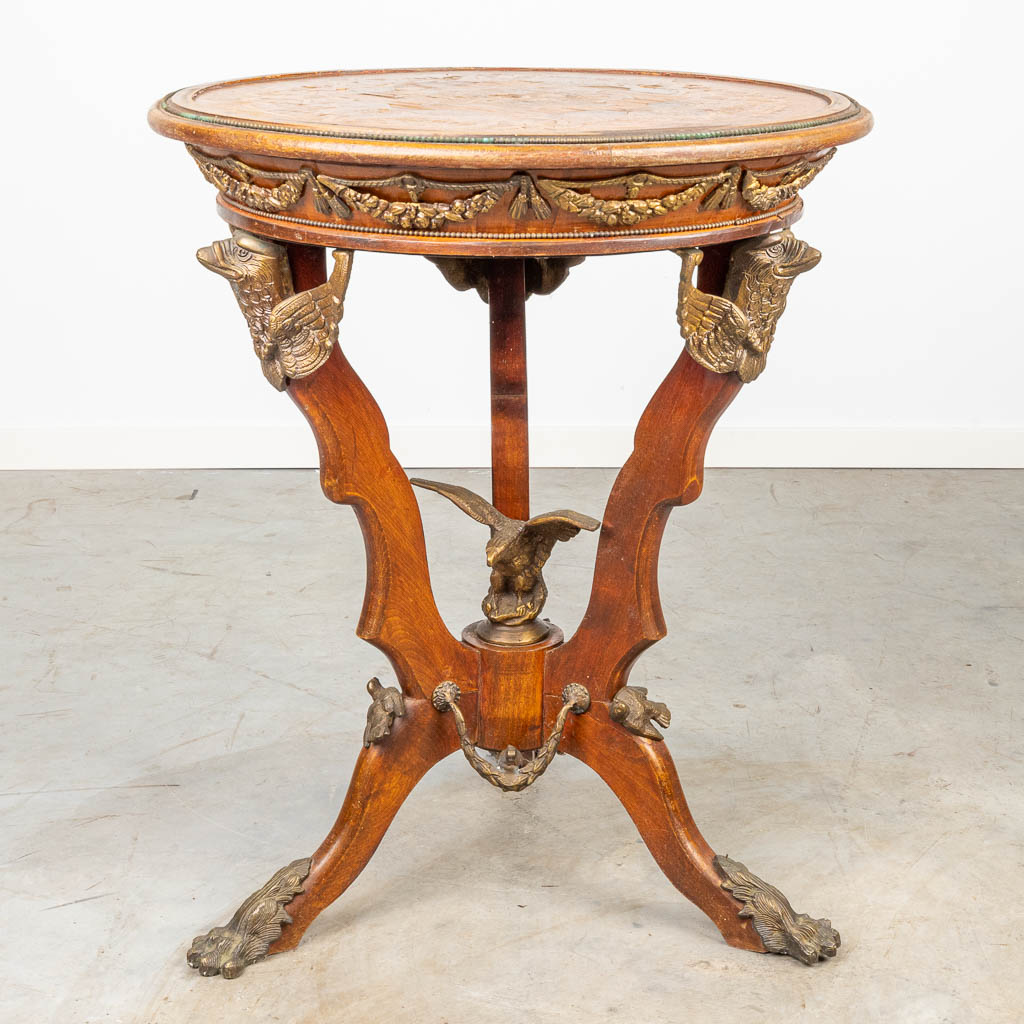 A side table inlaid with marquetry and mounted with bronze. 