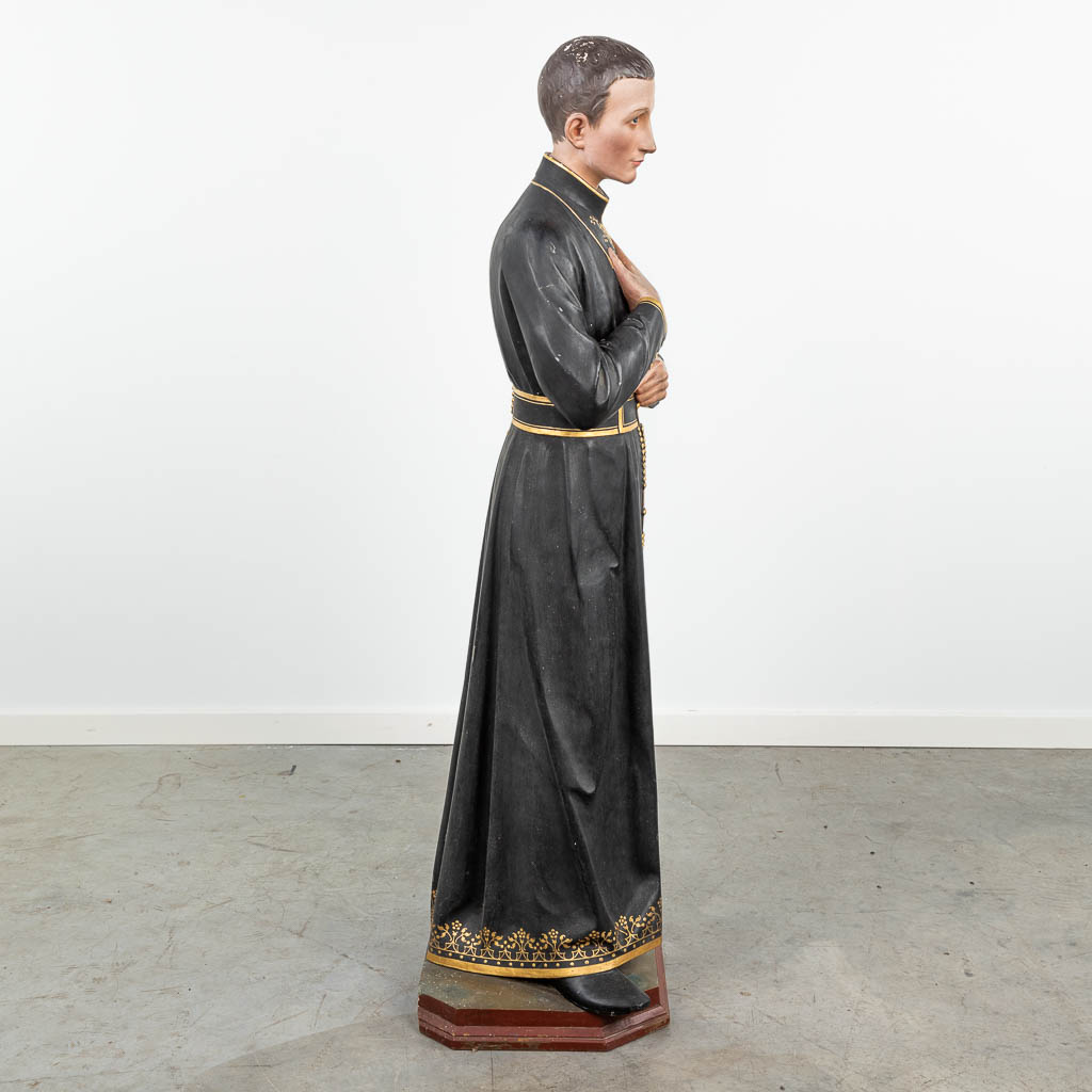 A figurine of a priest, made of patinated plaster. (H:128cm)