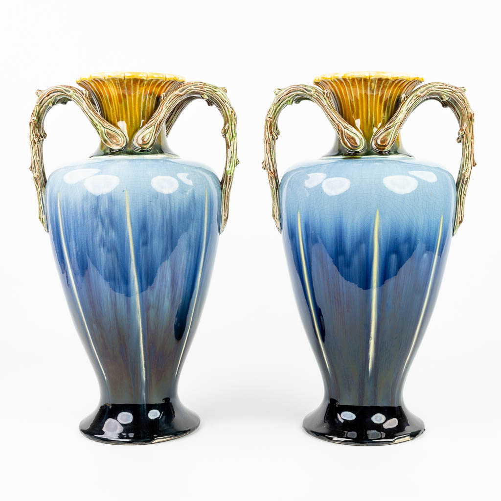 A pair of vases made of glazed faience in art nouveau style and made in Hasselt, Belgium. (H:50,5cm)
