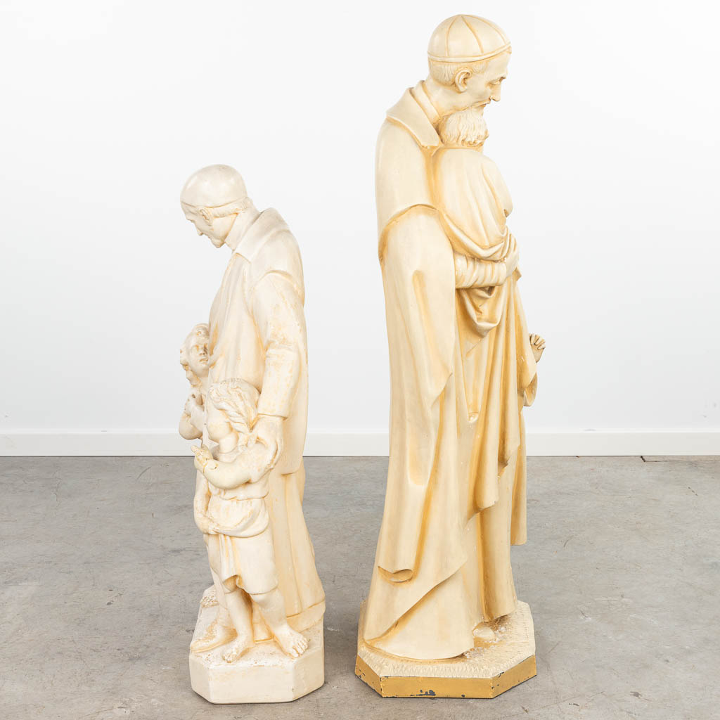 A collection of 2 monochrome patinated plaster statues of Holy Vincentius. (H:105cm)