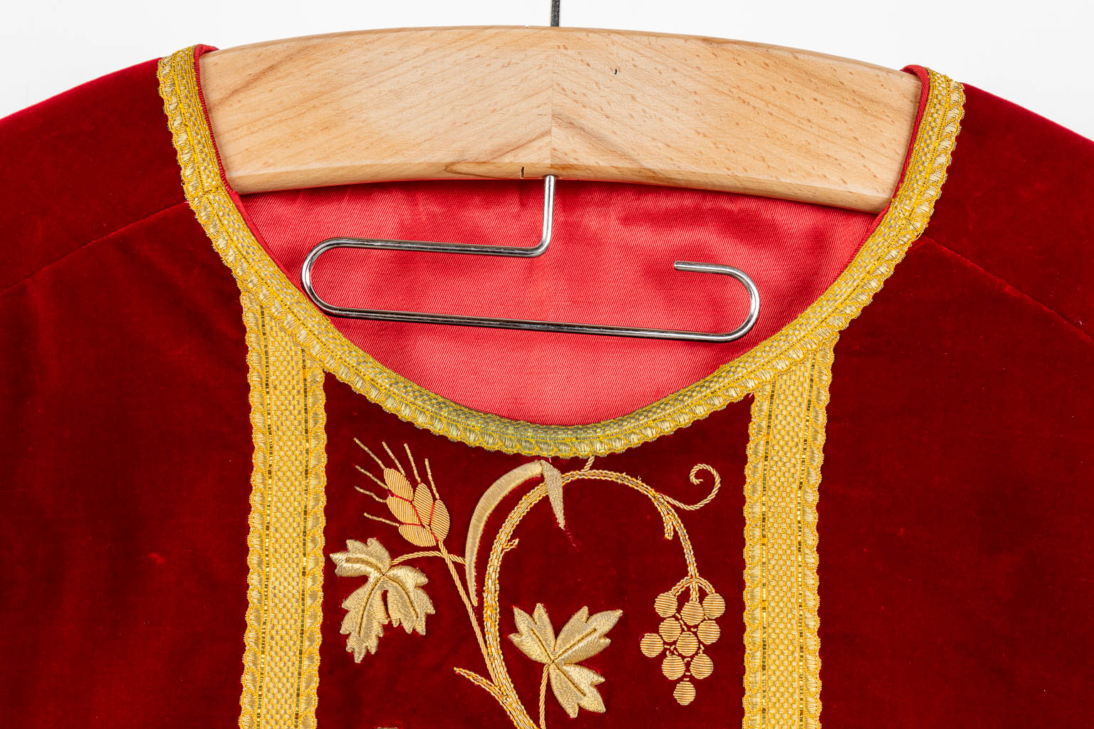 Two Roman Chasubles and stola, red fabric with thick gold thread embroideries.