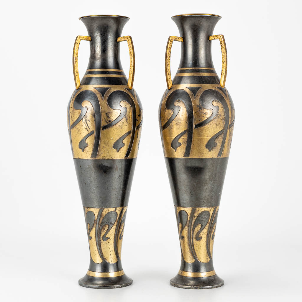 A pair of art nouveau vases, made of metal